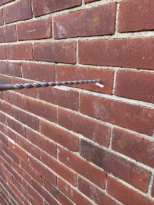 Drill new wall tie hole