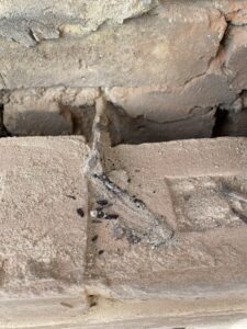 Original wall tie exposed during wall tie replacement works in Hythe, Kent