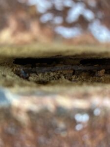 Heavily corroded original wall tie exposed prior to isolation in Deal, Kent