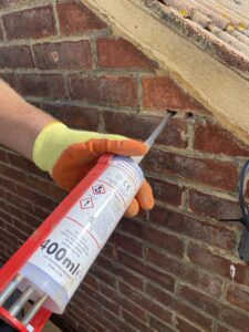 Resin fixing of lateral restraint tie during remedial masonry works